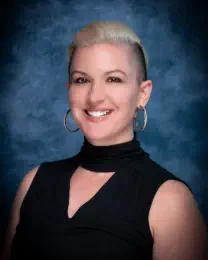 Portrait of a young woman on blue background